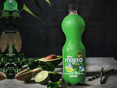 A bottle of mr. mojito classic mojito beverage surrounded by slices of lime, fresh mint, and tropical decor, evoking a refreshing and zesty drink experience.