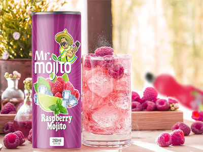 A vibrant can of mr. mojito raspberry mojito next to a refreshing glass filled with the pink beverage and ice, with raspberries scattered around a wooden surface and a sunny, plant-filled backdrop.